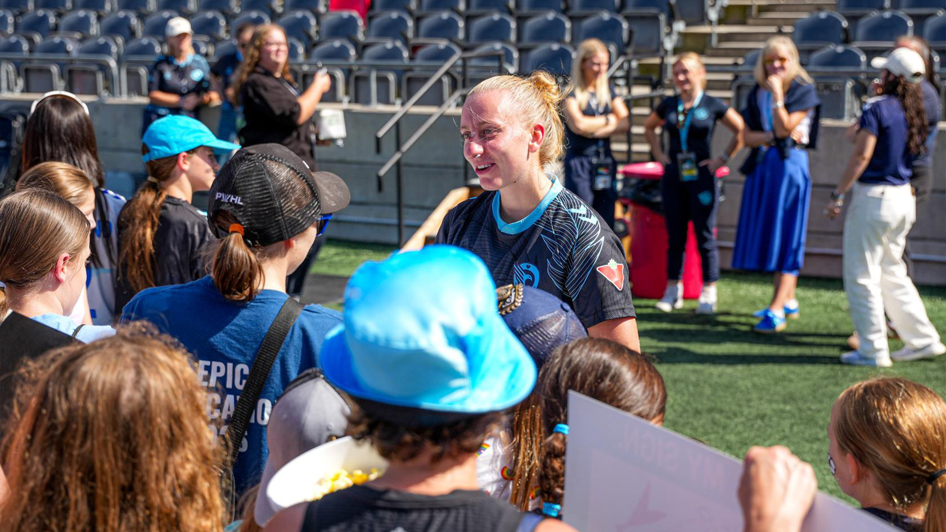 Nicola Golen meets fans on the field after an Ottawa Rapid FC Game